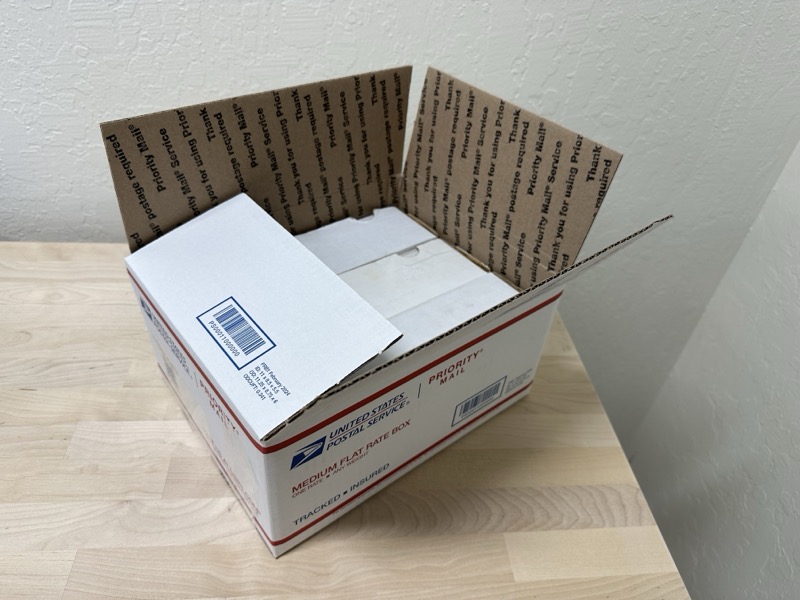 Another angle showing the BCW 550-count box fitting in the USPS Medium Flat Rate box with room for packing material